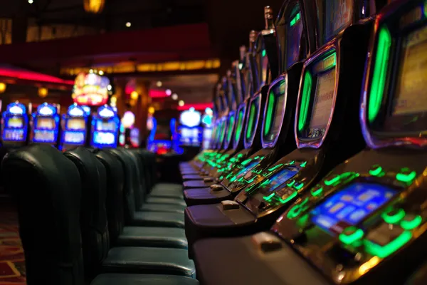 A woman in a luxurious green gown next to an ornate roulette wheel, capturing the upscale casino mood of VS999.