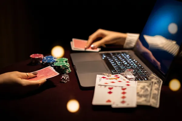 A player using their smartphone during a festive local event, representing VS999’s fully mobile-friendly casino.